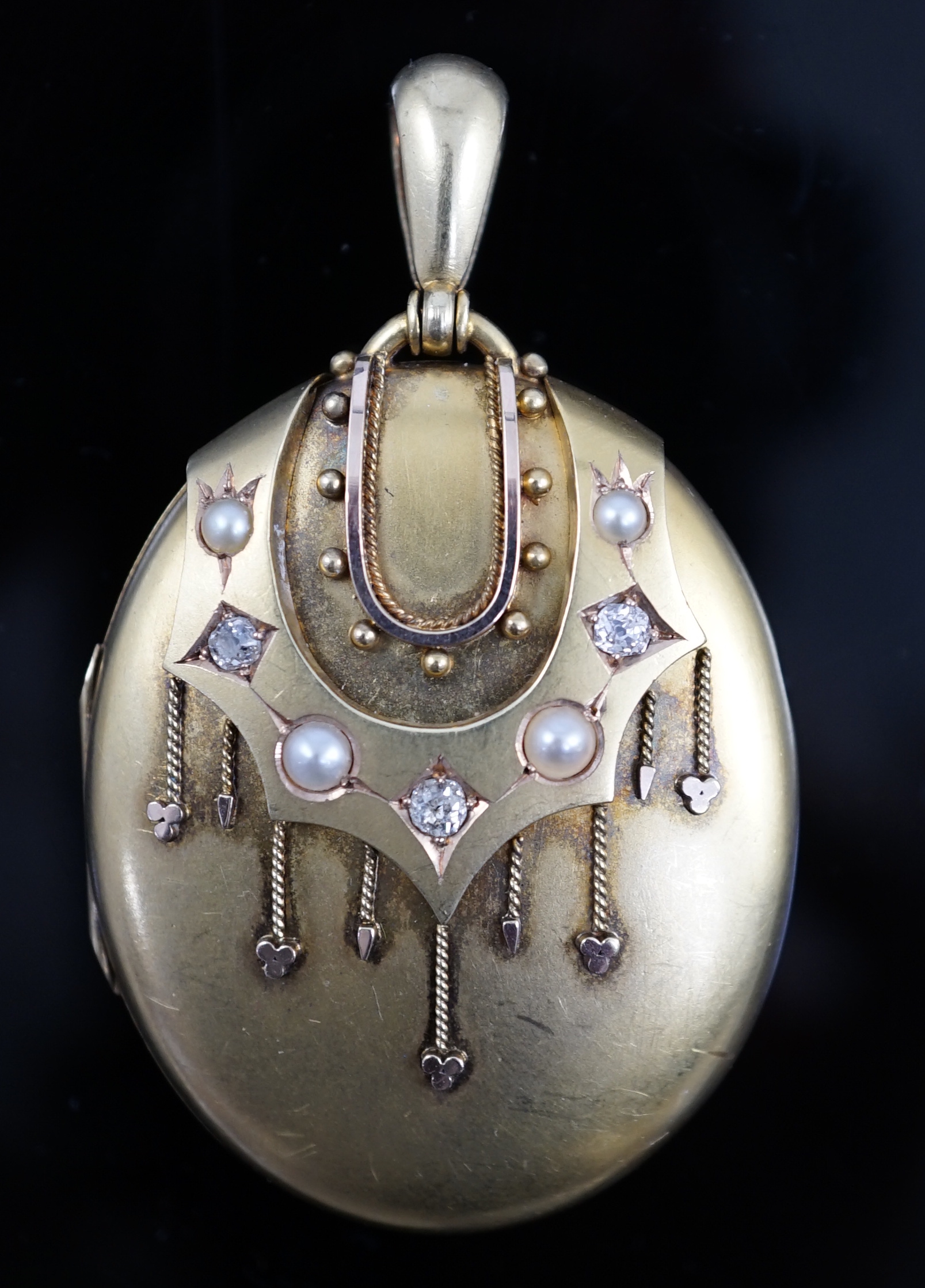 A Victorian gold, diamond and split pearl set oval locket